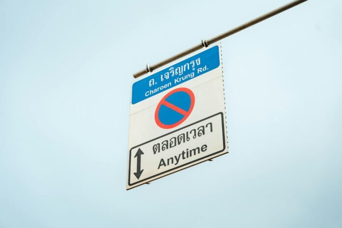 Street sign on Charoen Krung Road in Bangkok, highlighting no stopping anytime.