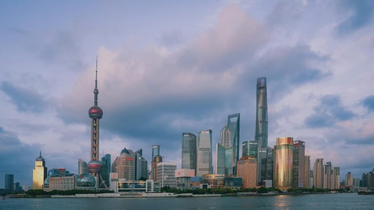 Beautiful dusk view of Shanghai skyline featuring famous landmarks.