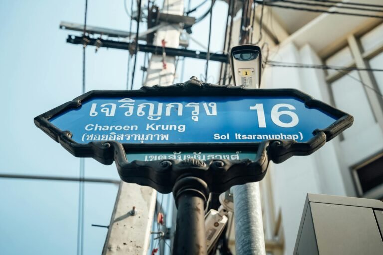 A classic street sign marking Soi Itsaranuphap on Charoen Krung Road in Bangkok, Thailand.