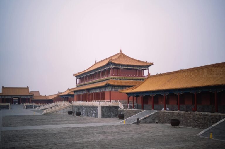 Stunning view of traditional Forbidden City architecture under a calming sky in Beijing, China.