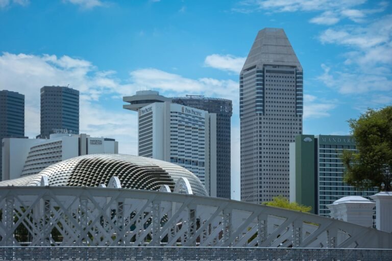 Explore Singapore's architectural marvels featuring the skyline and modern skyscrapers on a clear day.