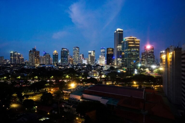 Dazzling night view of Jakarta's illuminated skyline showcasing modern skyscrapers and vibrant lights.