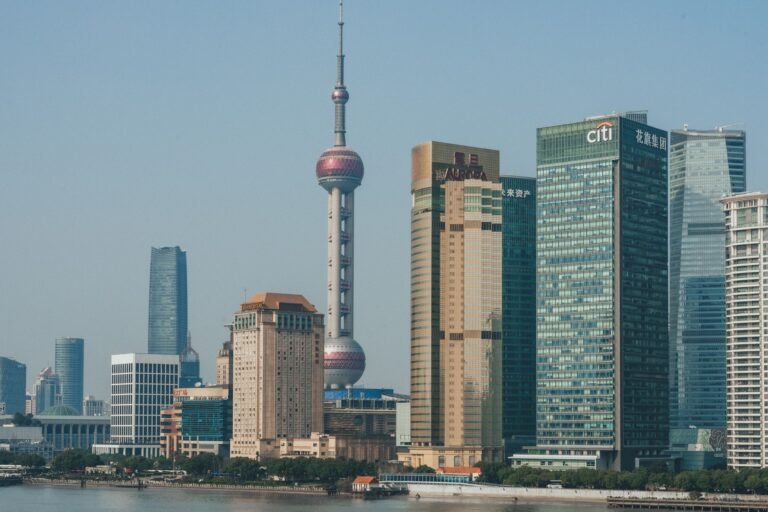 A stunning view of Shanghai's Pudong skyline with the iconic Oriental Pearl Tower and modern skyscrapers.