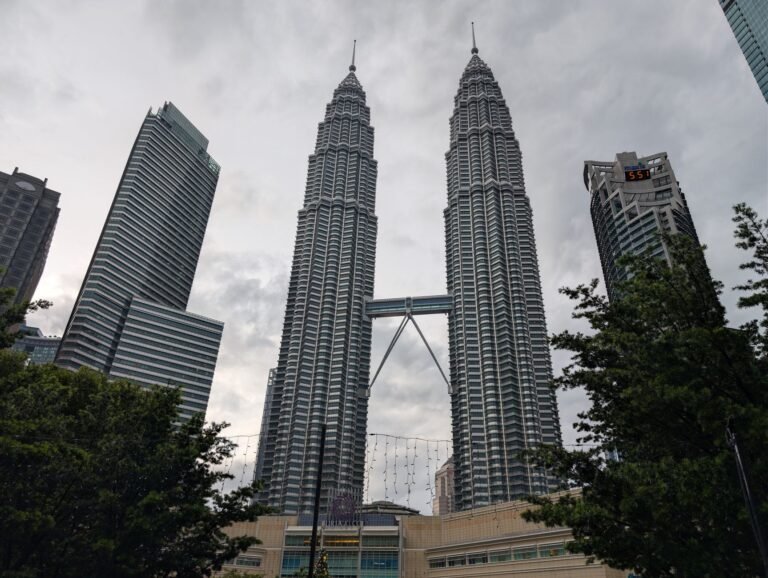 Stunning view of the Petronas Twin Towers in Kuala Lumpur, Malaysia. Iconic modern architecture.